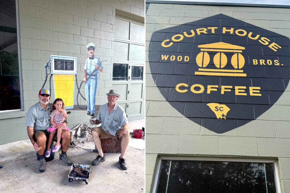 A family sits outside a store by a mural of a gas tank; a sign for coffee