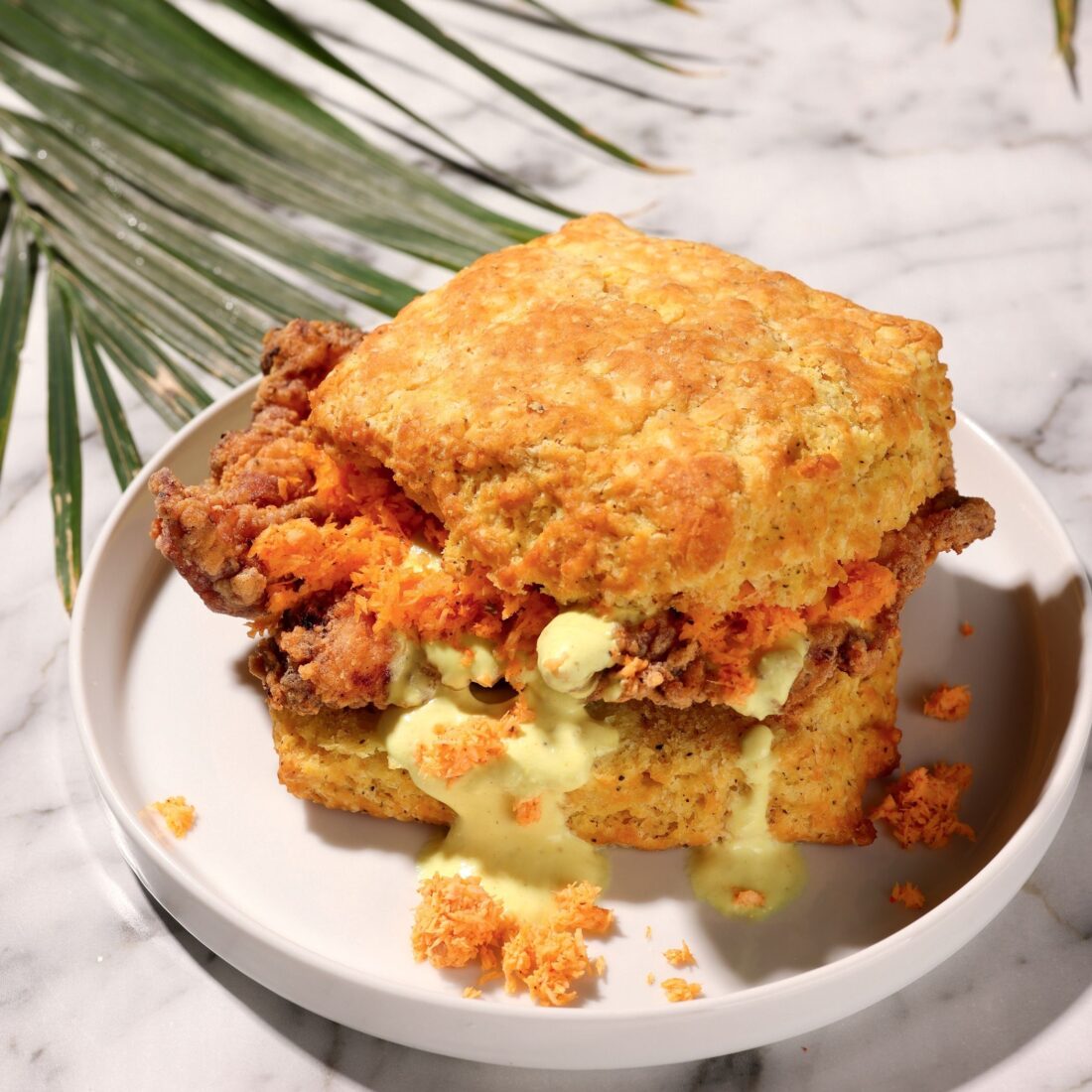 A chicken biscuit on a plate