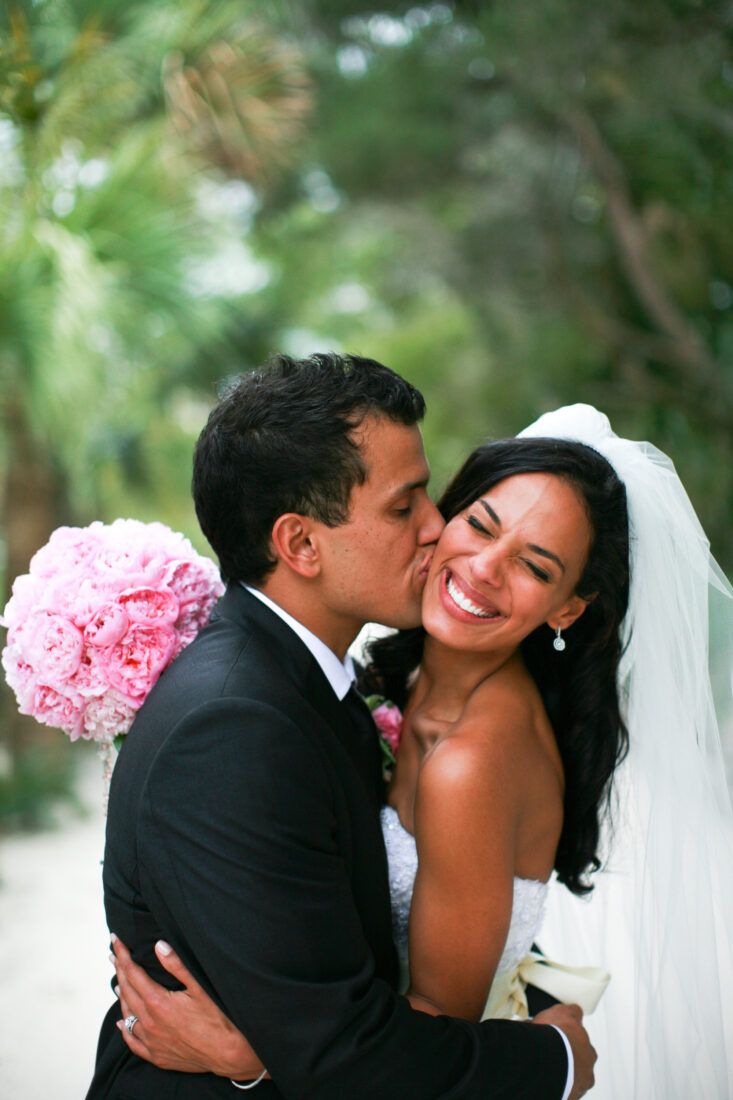 A bride and groom embrace