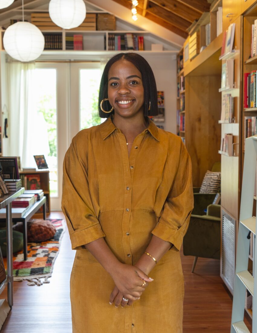 A portrait of a woman in an orange dress