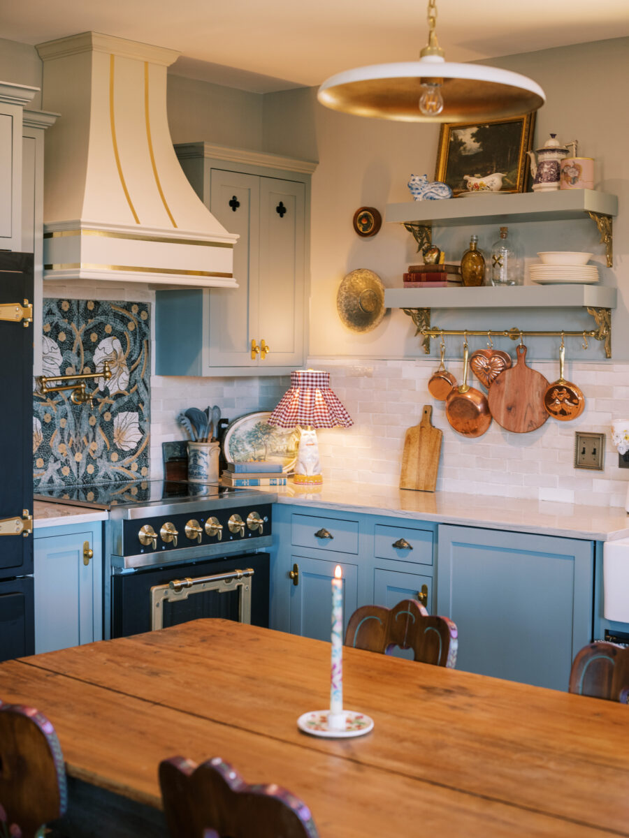 A blue kitchen with white tile