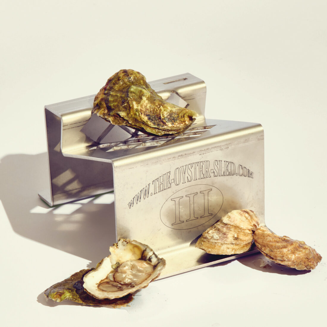 An oyster shucker with oysters on it