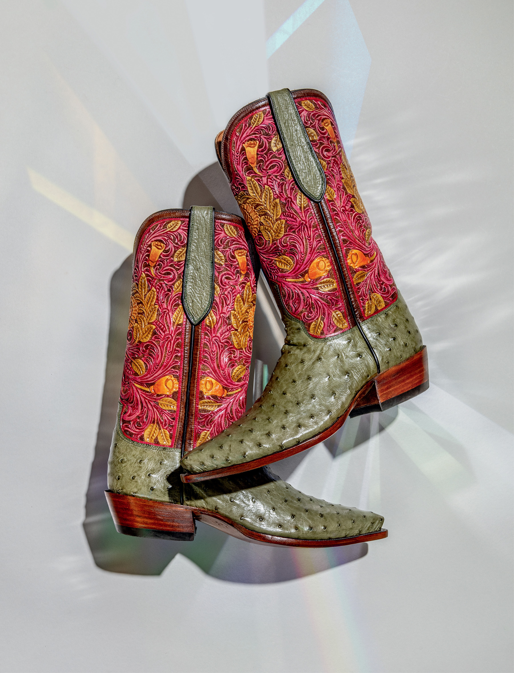 A pair of stylish red and gray boots