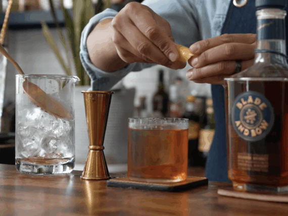 A person makes an old fashioned