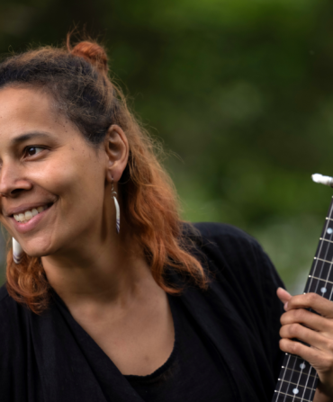 A woman holding a banjo